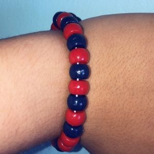 Red and navy blue beads with black string bracelet